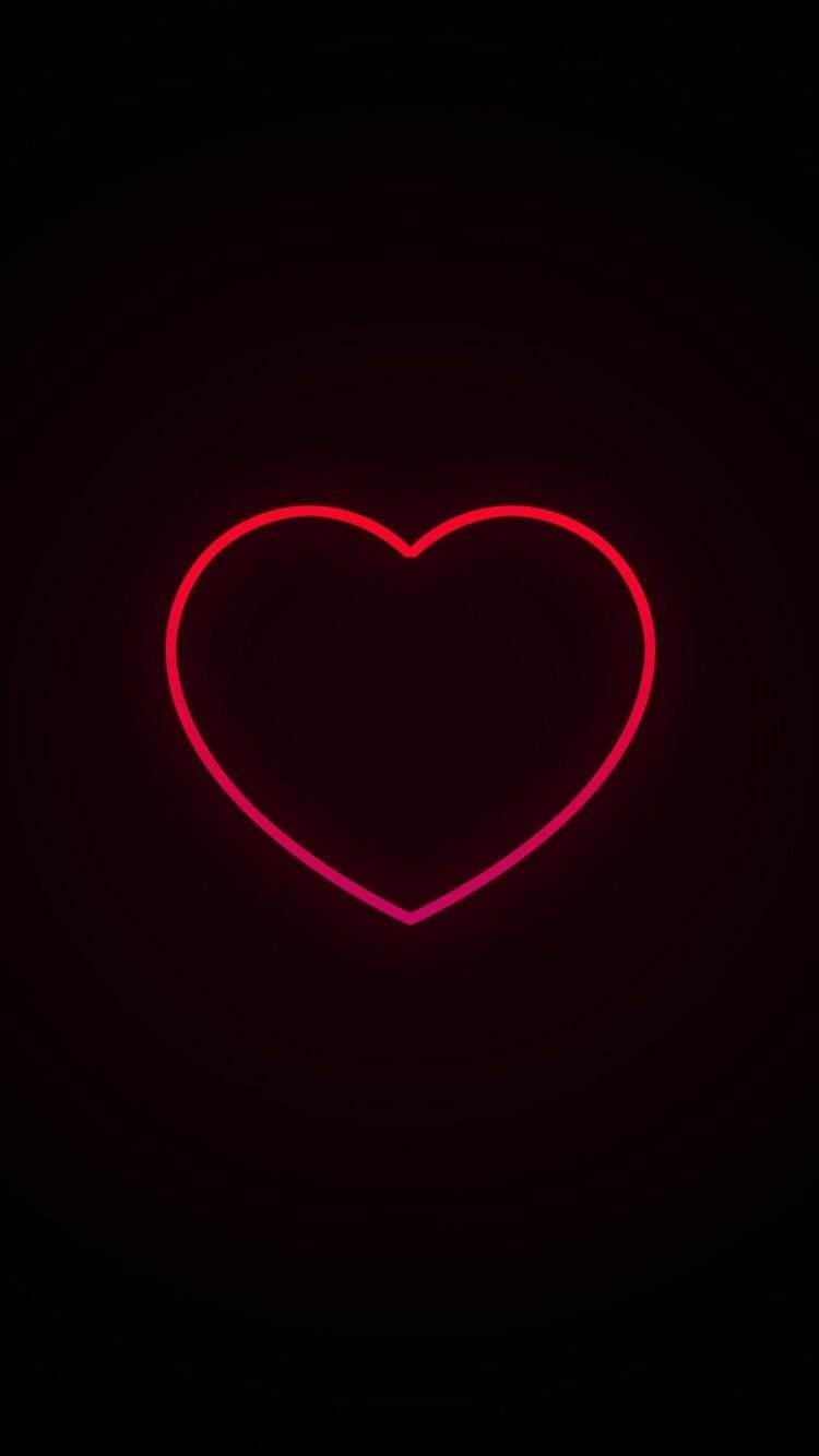 Неоновые сердечки на черном фоне