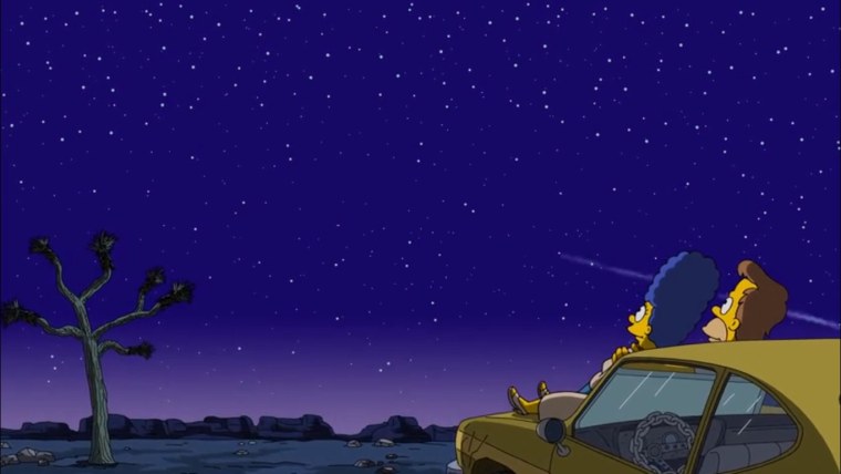 Гомер сидит на машине