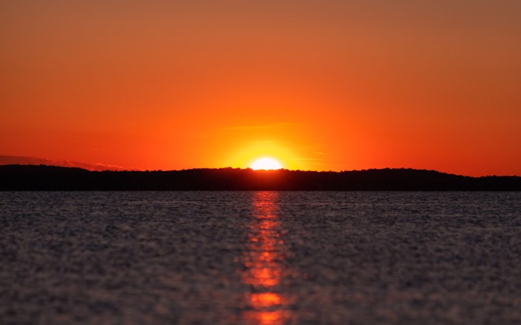 Солнечный блик закат