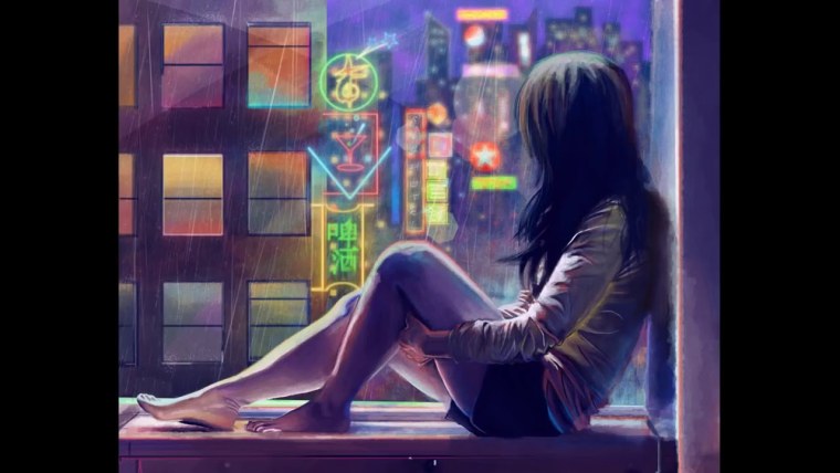 Девочка сидит у окна