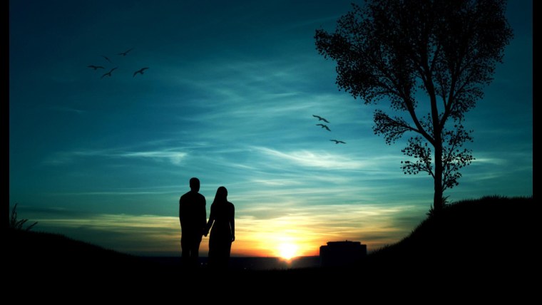 Силуэты влюбленных на закате