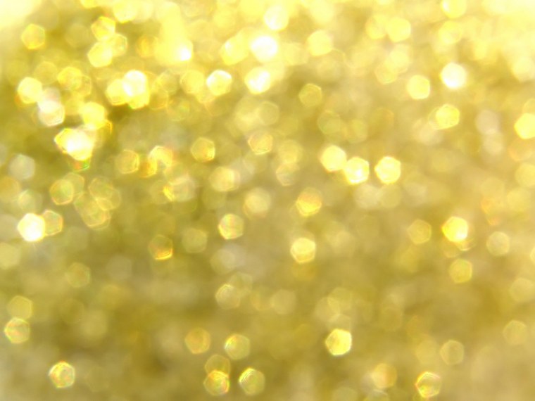 Золотой фон с блестками и светящиеся