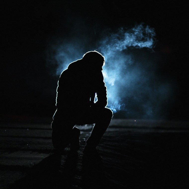 Человек в черном капюшоне