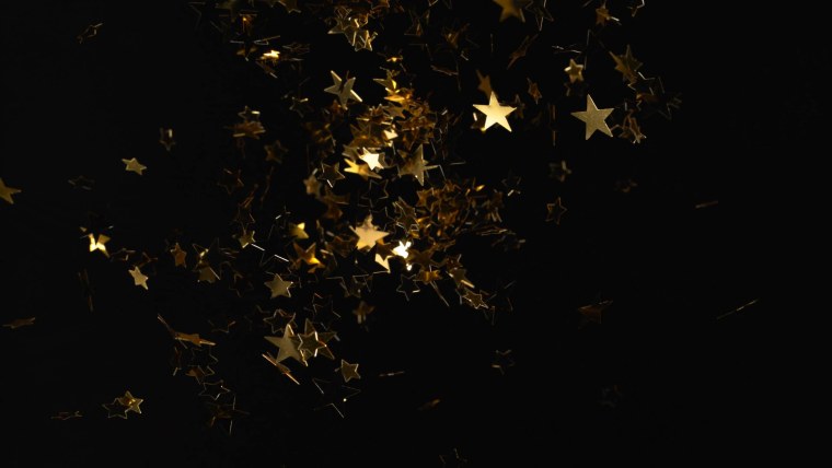Конфетти звезды на черном фоне