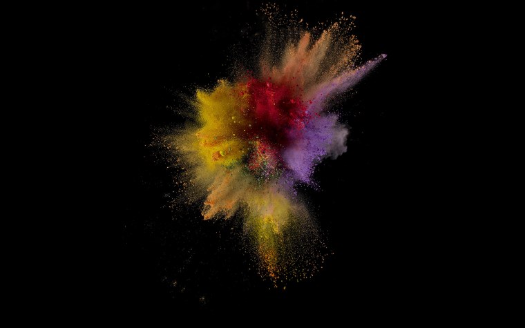 Взрыв красок на черном фоне