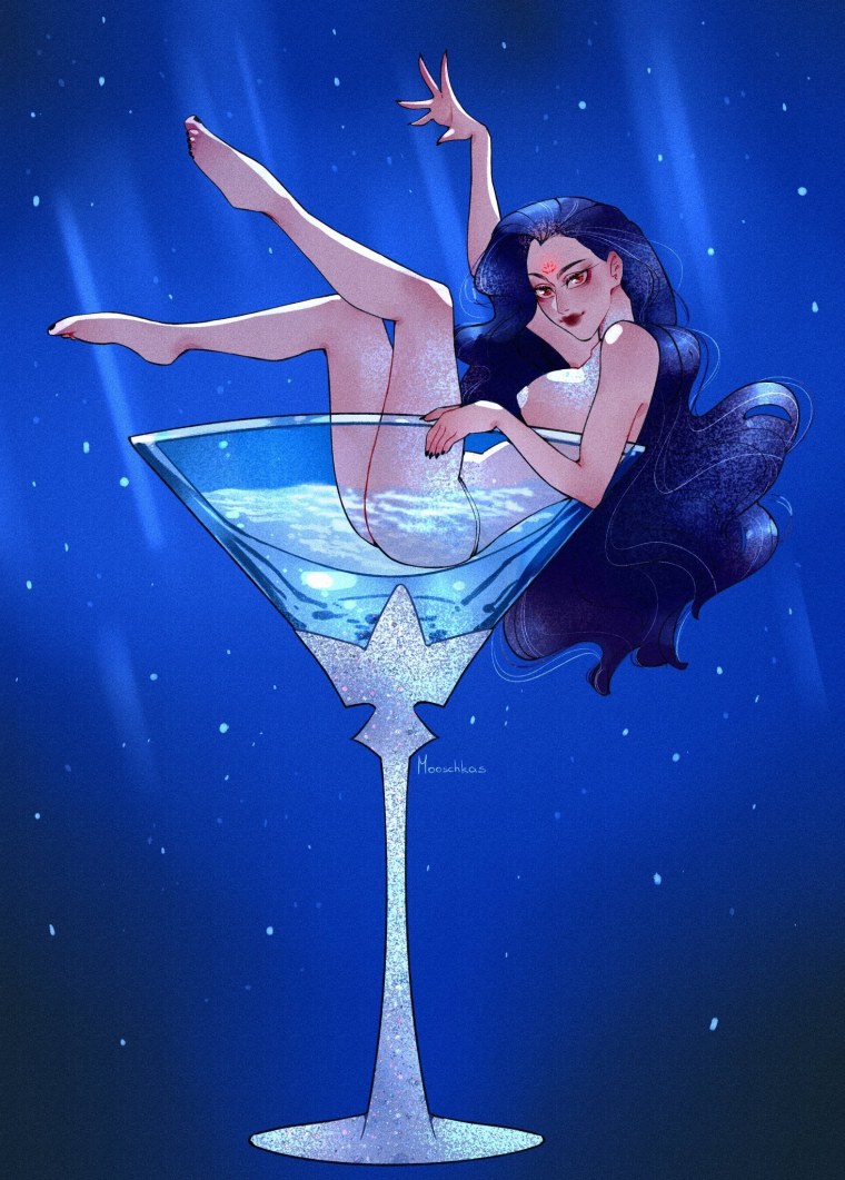 Женщина сидит с бокалом