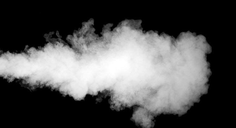 Дым из под колес на черном фоне