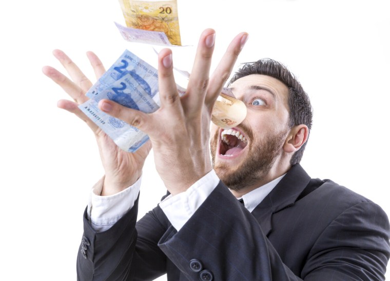 Жадный человек с деньгами