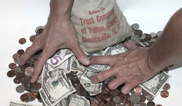 Жадный человек с деньгами