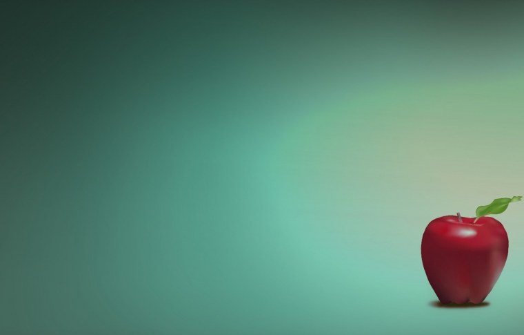 Зеленые яблоки на деревянном столе