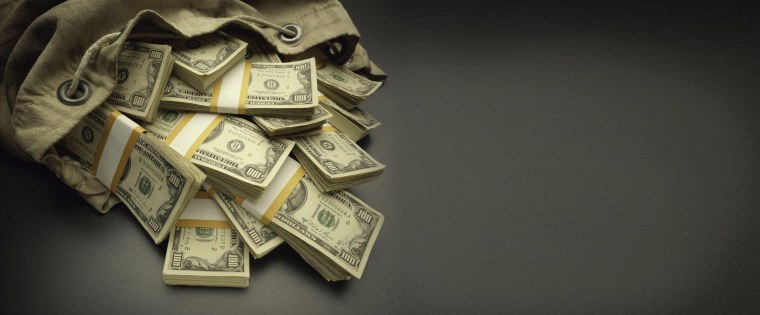 Доллары на темном фоне