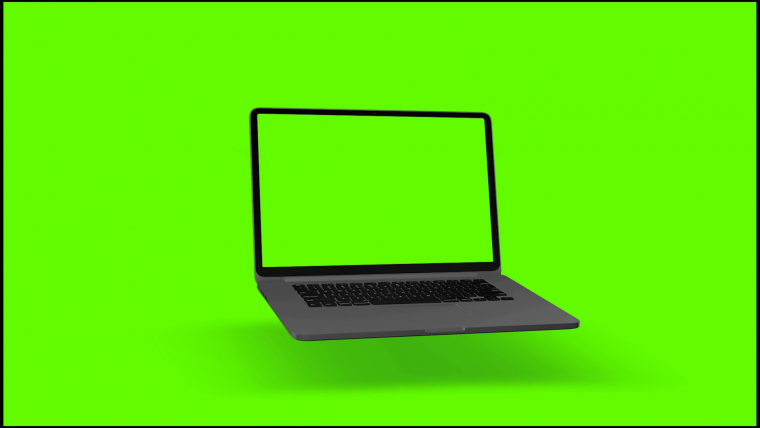 Ноутбук на зеленом фоне