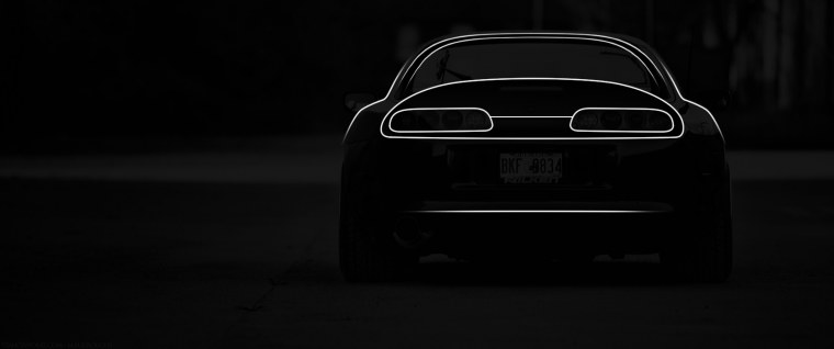 Toyota Supra на черном фоне