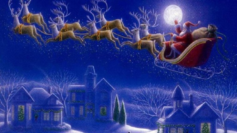 Санта на оленях в небе