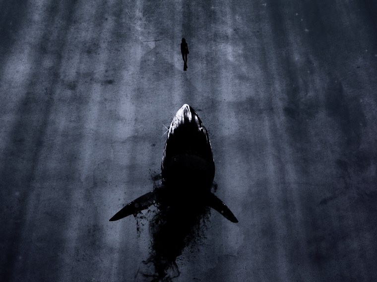 Знак акулы в океане