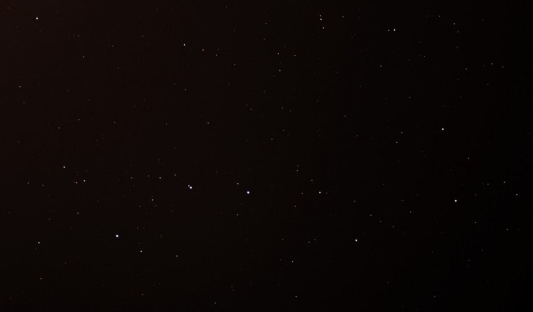 Пылинки на черном фоне