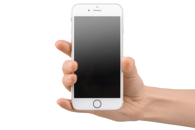 Айфон в руке на белом фоне