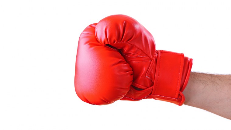 Кулак в боксерской перчатке