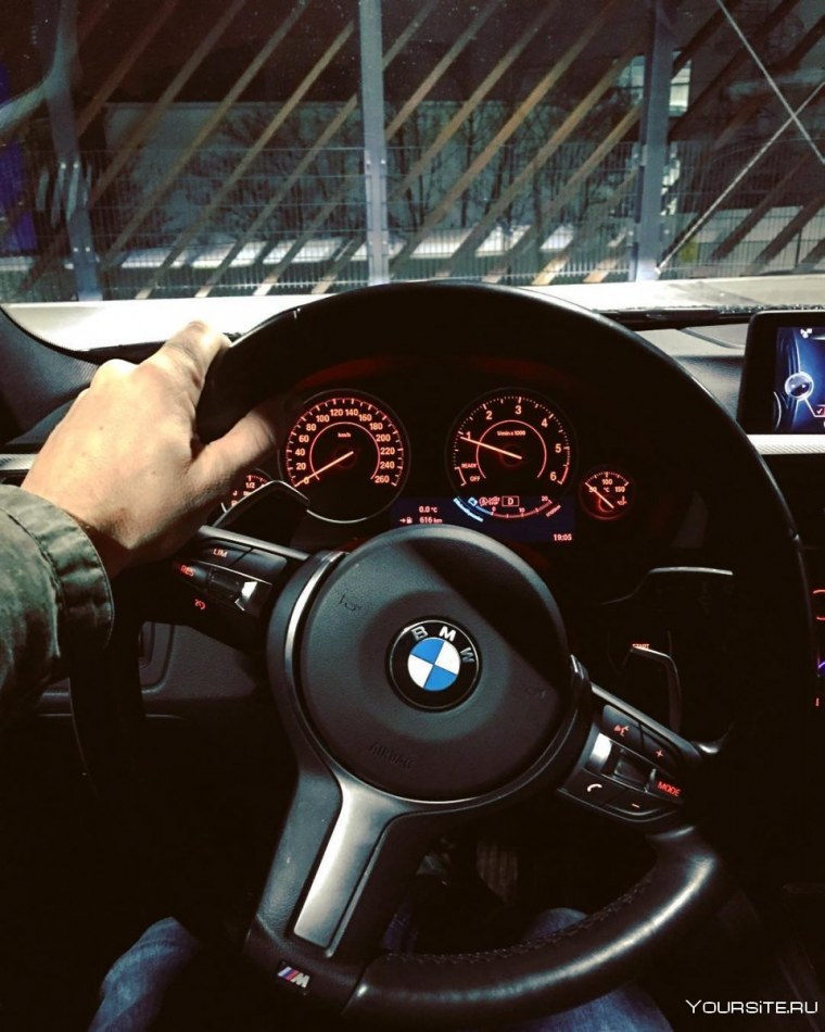 За рулём BMW 740